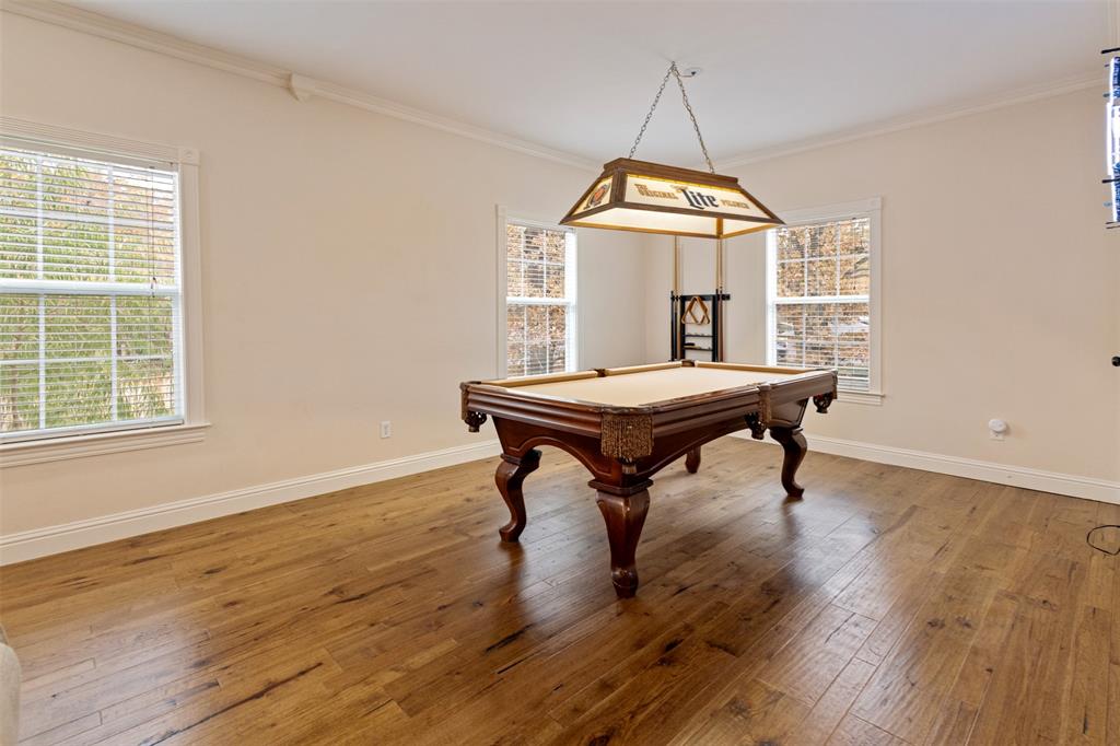 106 White Oak Mabank, TX 75156 - Photo 9 of 32 a room with wooden floor and windows