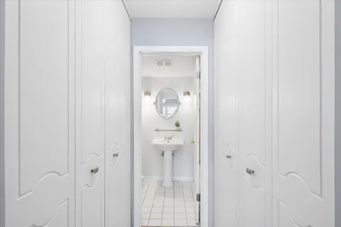 a glass door with a bathroom sink