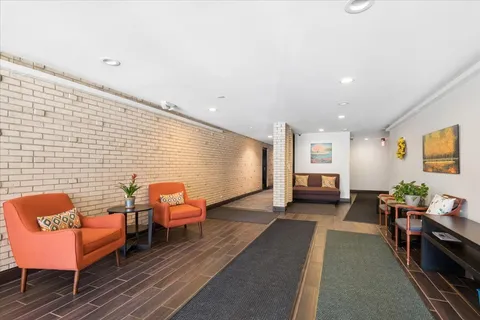 a living room with furniture and a rug