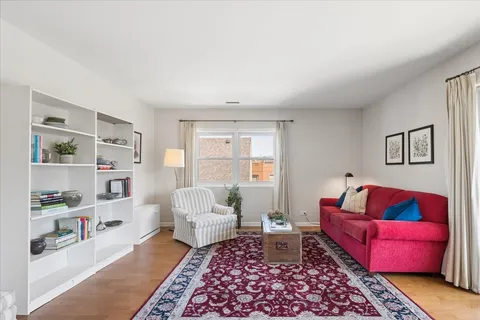 a living room with furniture and a rug