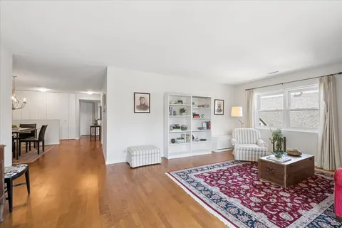 a living room with furniture and a rug