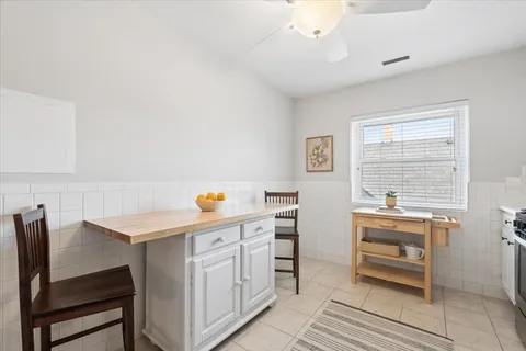 a kitchen that has a table and chair in it
