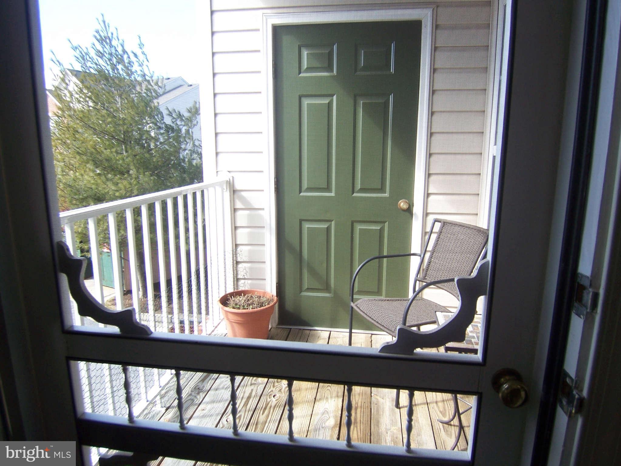 3012 Hunting Ridge Drive, Unit 3012 Owings Mills, MD 21117 - Photo 11 of 11 Deck with screened door