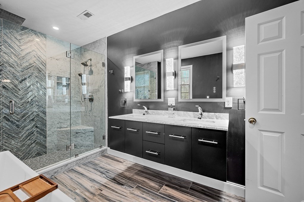 3 Carter Way Worcester, MA 01609 - Photo 18 of 41 a spacious bathroom with a shower sink and mirror