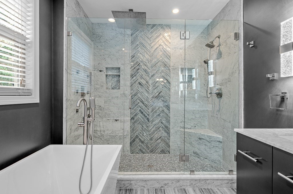 3 Carter Way Worcester, MA 01609 - Photo 19 of 41 a bathroom with a granite countertop shower a sink and a mirror