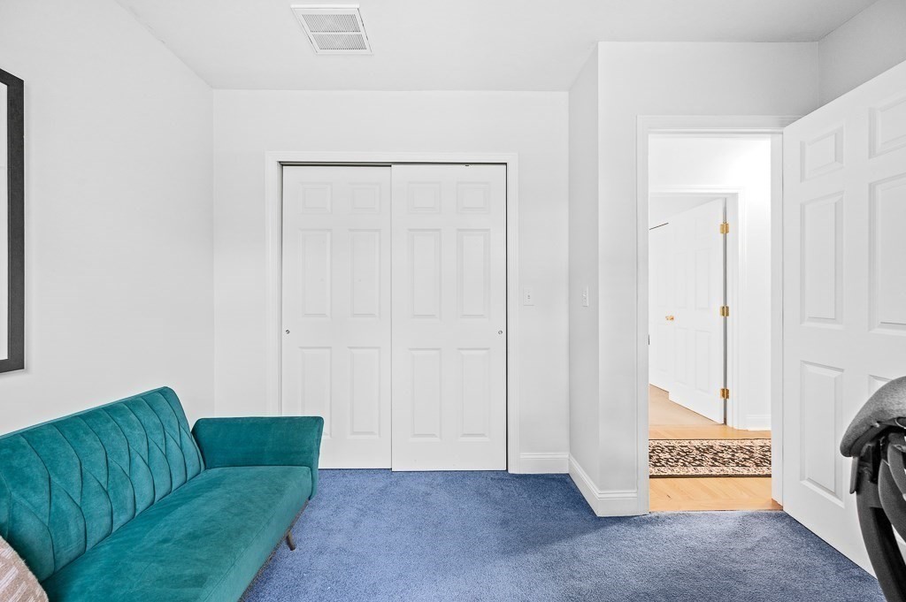 3 Carter Way Worcester, MA 01609 - Photo 23 of 41 a living room with furniture and a gate