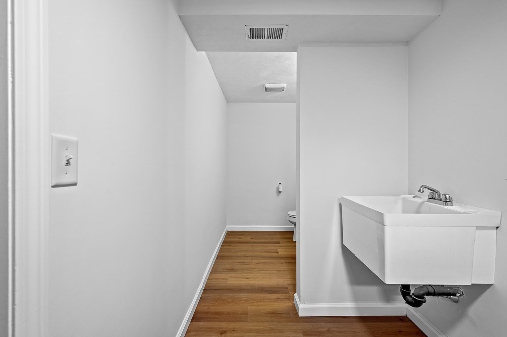 3 Carter Way Worcester, MA 01609 - Photo 32 of 41 a bathroom with a sink and mirror