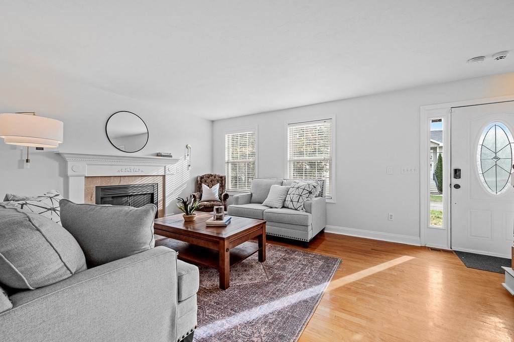 3 Carter Way Worcester, MA 01609 - Photo 4 of 41 a living room with furniture a rug and a fireplace