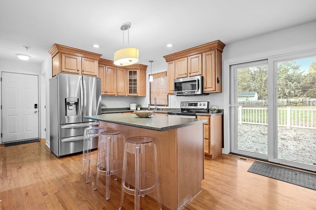 3 Carter Way Worcester, MA 01609 - Photo 7 of 41 a kitchen with stainless steel appliances granite countertop a refrigerator stove top oven and sink