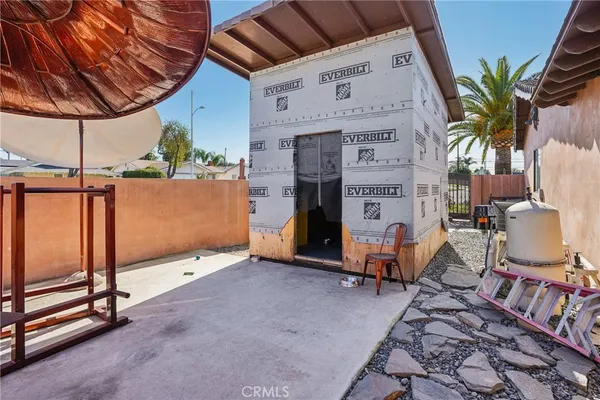 a view of a swimming pool with sitting area