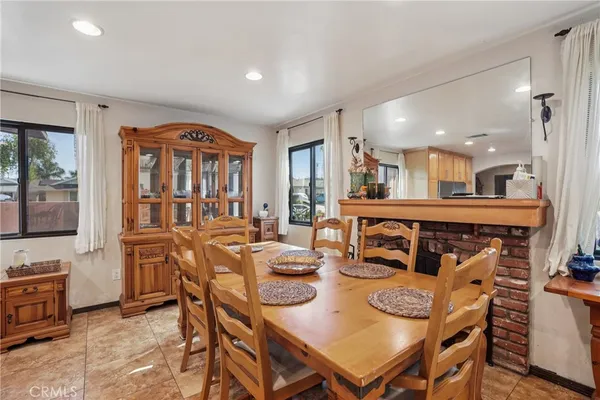 a living room with furniture a rug and a flat screen tv