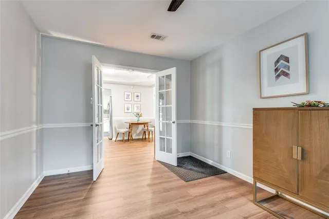 a view of a livingroom with furniture and workspace