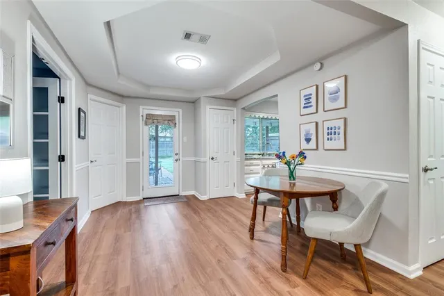 a workspace with furniture and wooden floor
