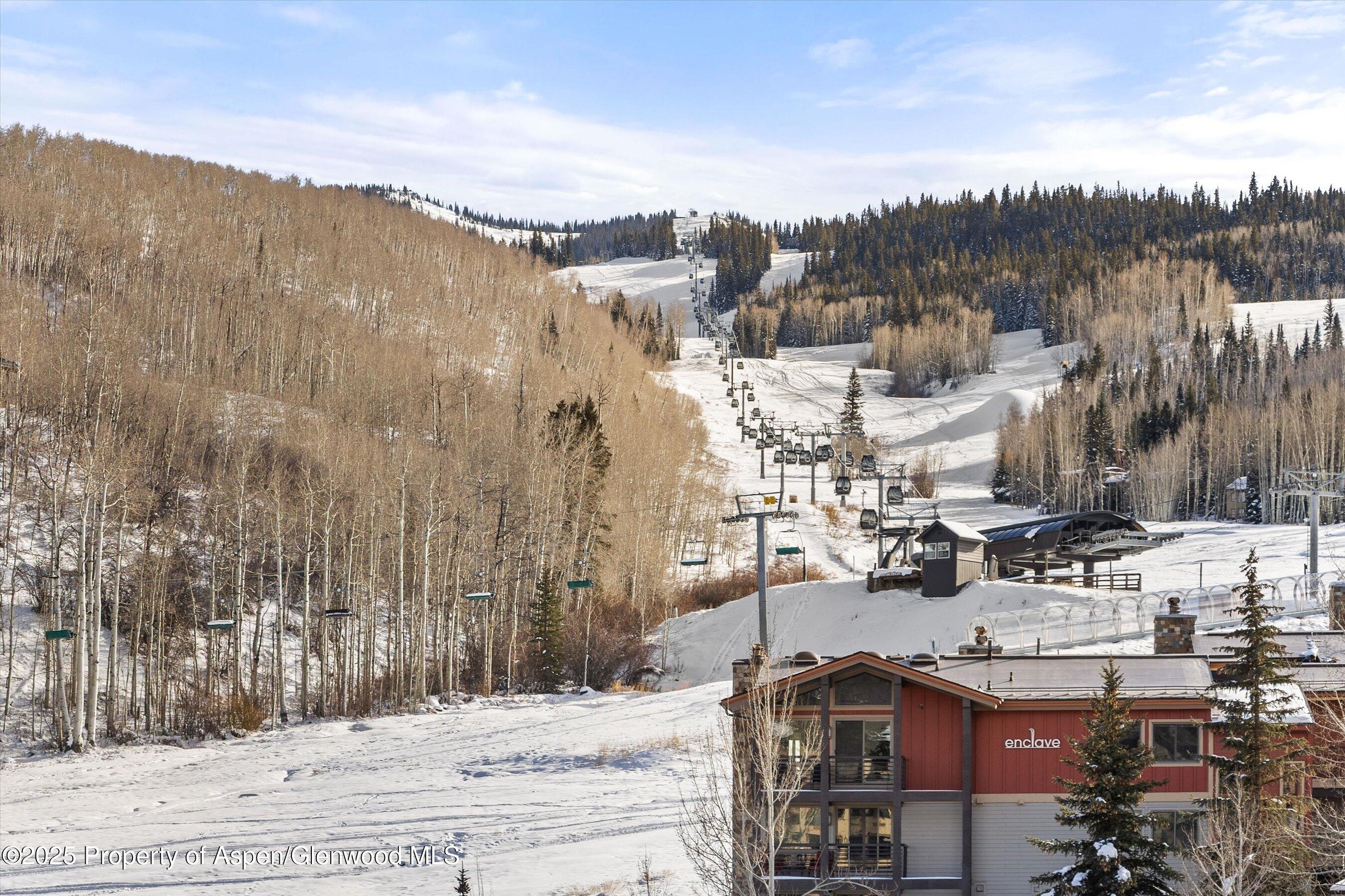 119 Wood Road, Unit 403 Snowmass Village, CO 81615 - Photo 10 of 27 a view of a city with tall buildings
