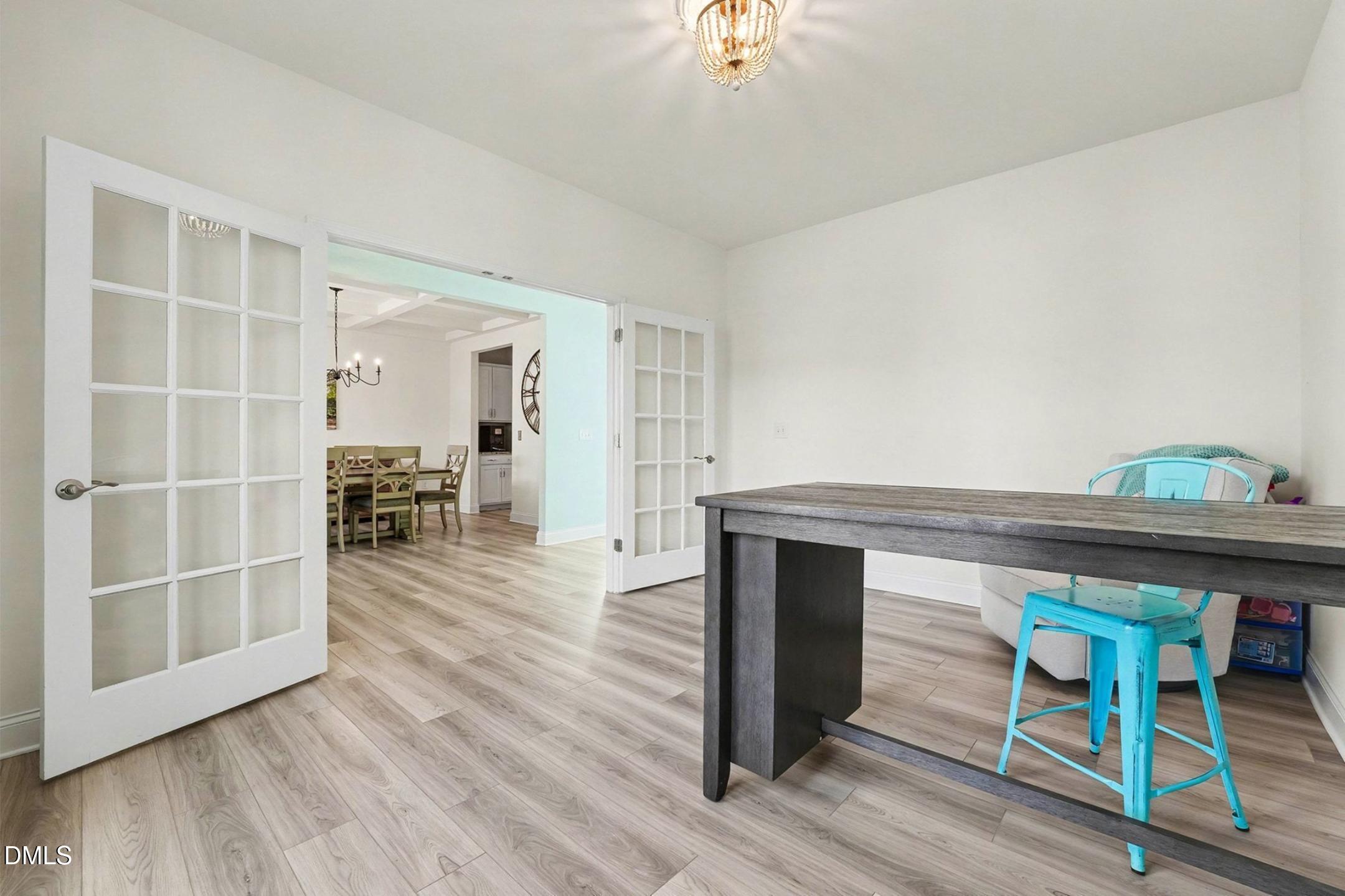 185 Twilight Trail Willow Spring, NC 27592 - Photo 12 of 42 a room with wooden floor and furniture