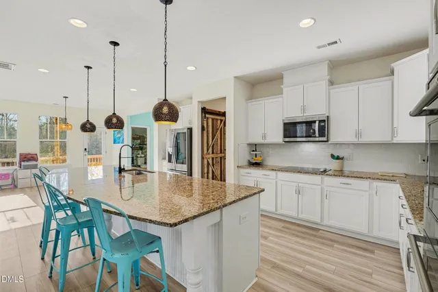 a kitchen with sink and window