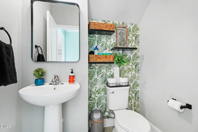 a spacious bedroom with a bed and ceiling fan