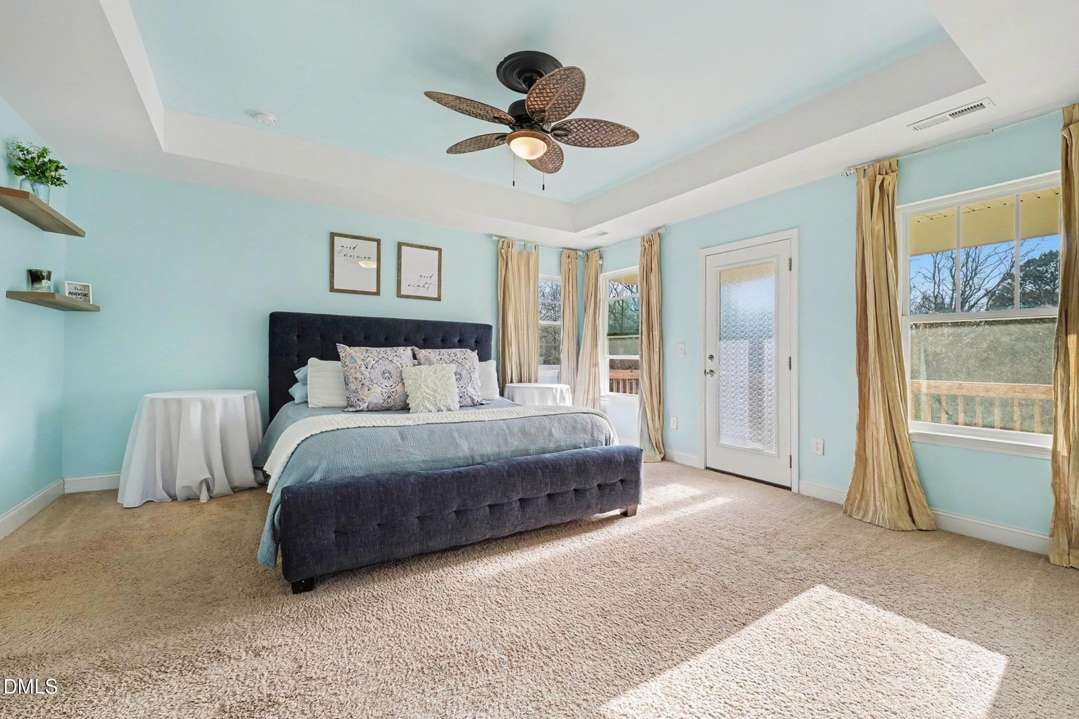 185 Twilight Trail Willow Spring, NC 27592 - Photo 20 of 42 a spacious bedroom with a bed and ceiling fan