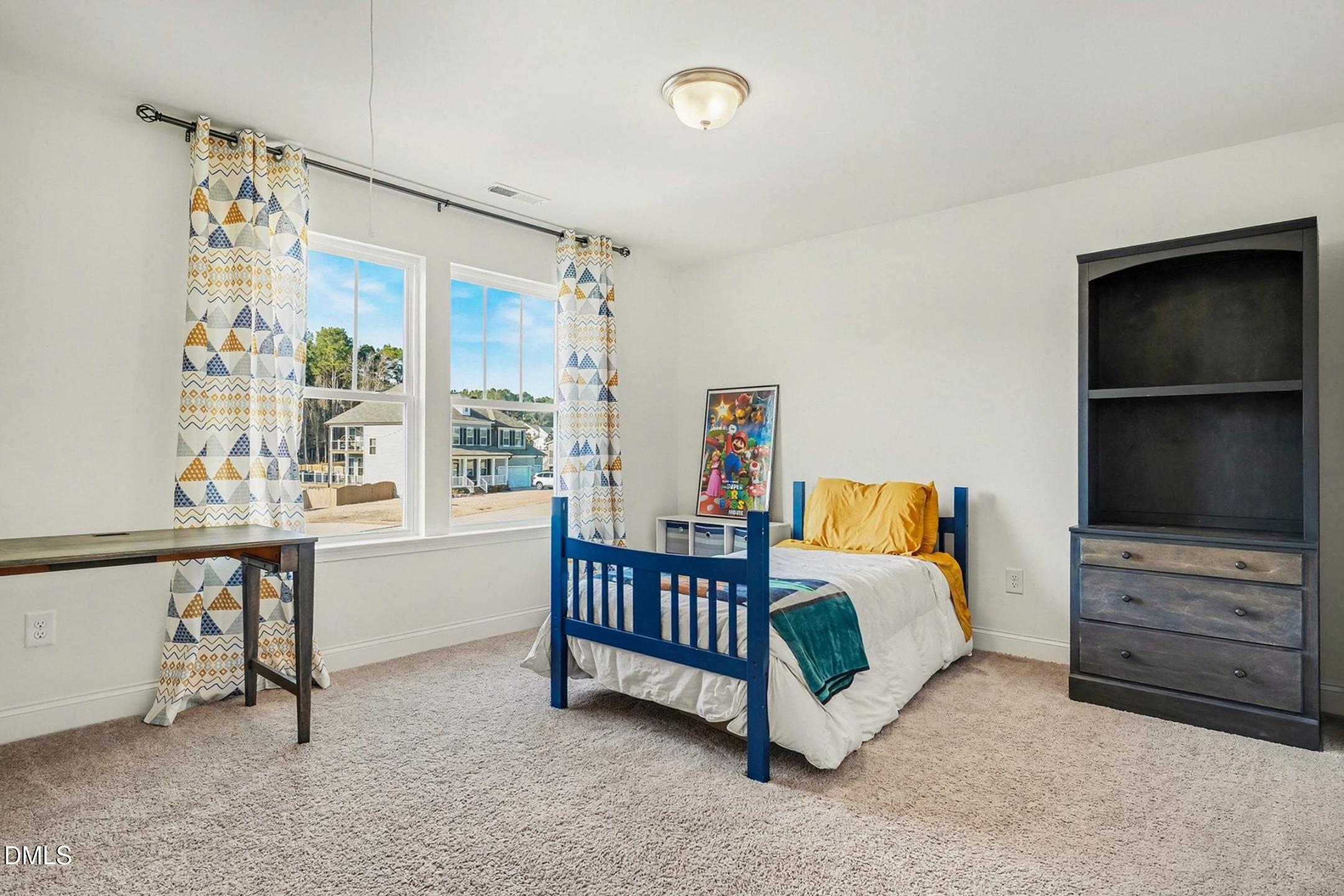 185 Twilight Trail Willow Spring, NC 27592 - Photo 29 of 42 a bedroom with furniture and a window