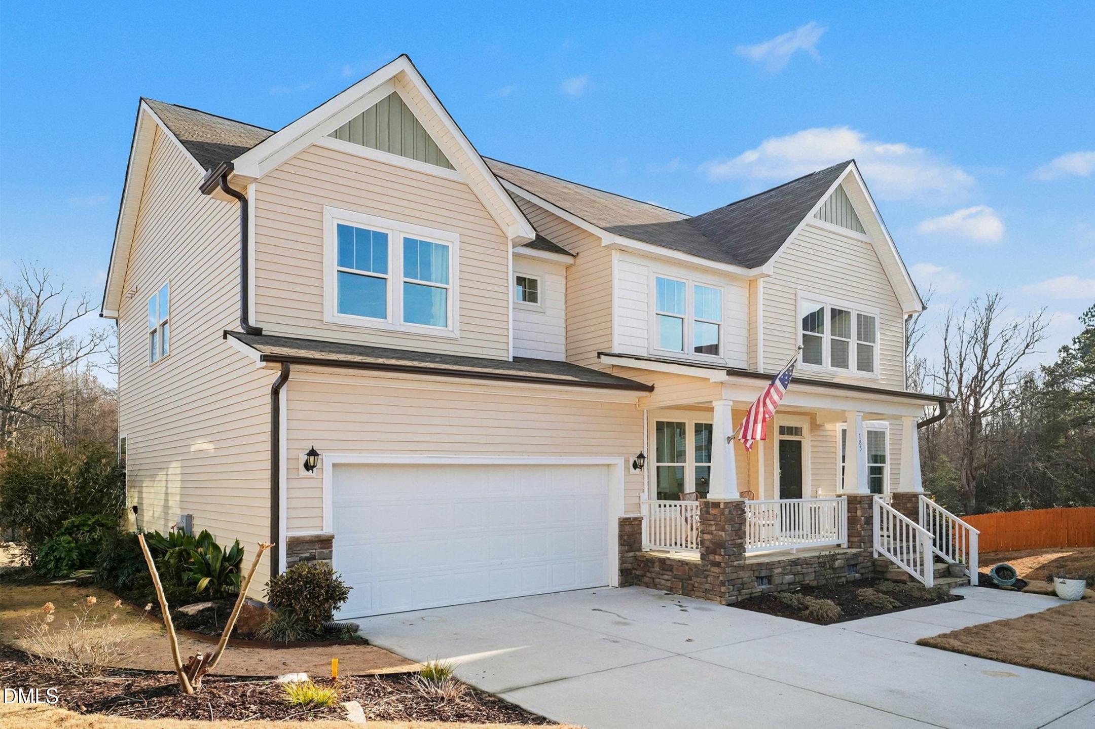 185 Twilight Trail Willow Spring, NC 27592 - Photo 3 of 42 a front view of a house with a garage