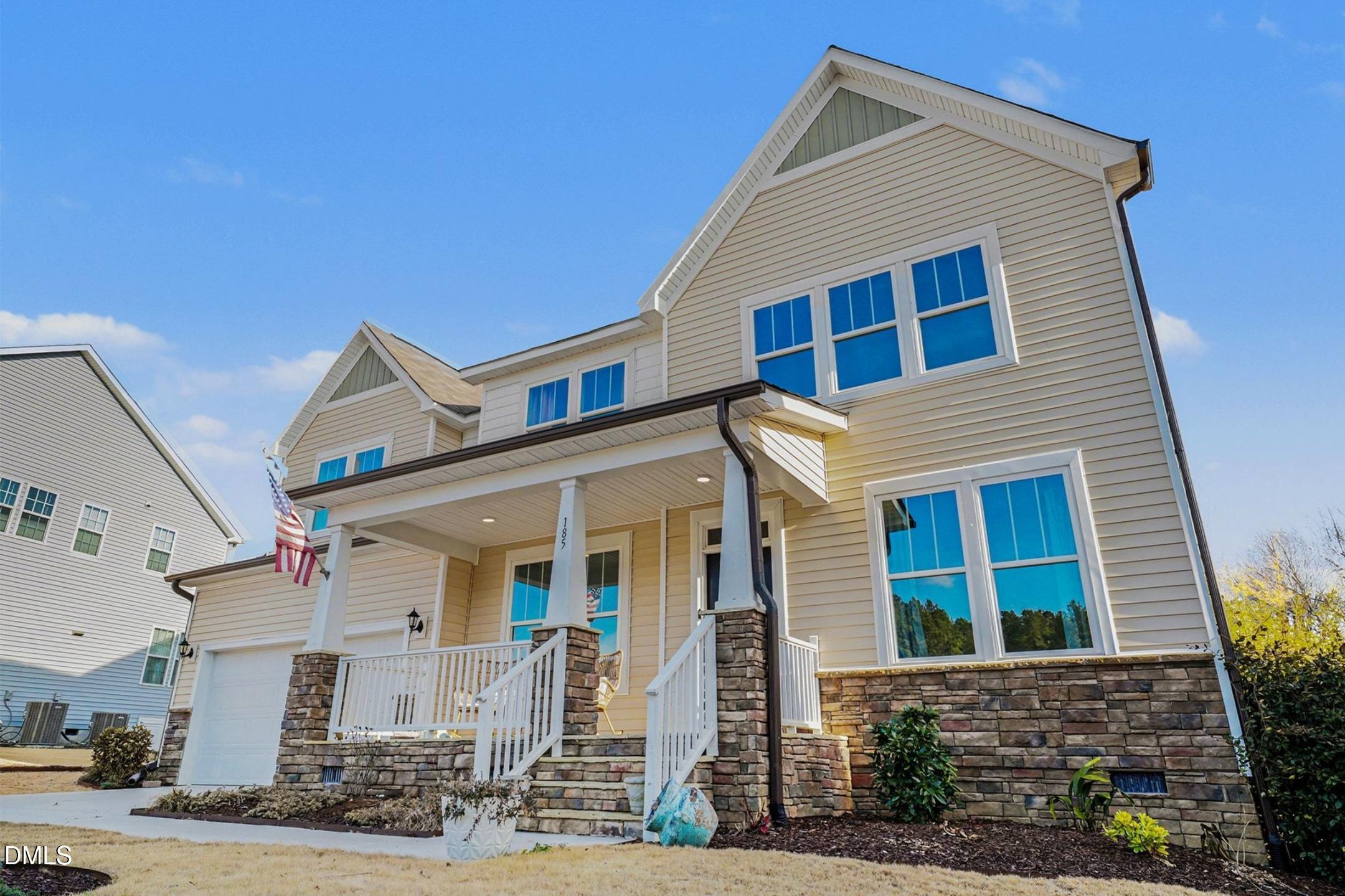185 Twilight Trail Willow Spring, NC 27592 - Photo 4 of 42 a front view of a house with garden
