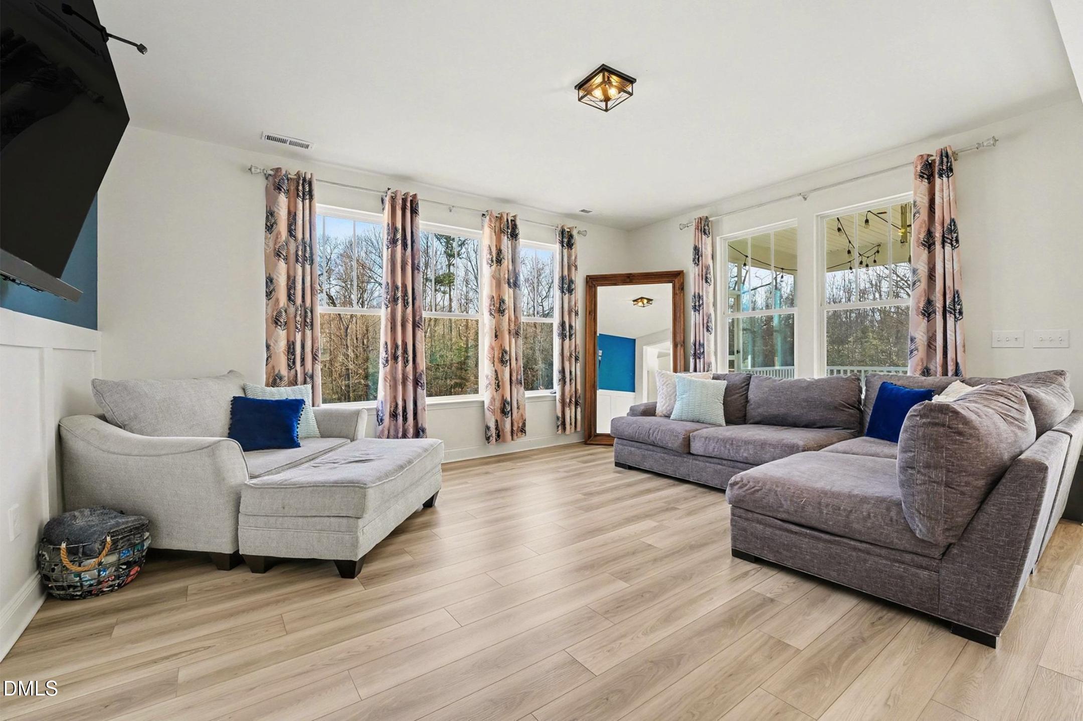 185 Twilight Trail Willow Spring, NC 27592 - Photo 6 of 42 a living room with furniture and a flat screen tv
