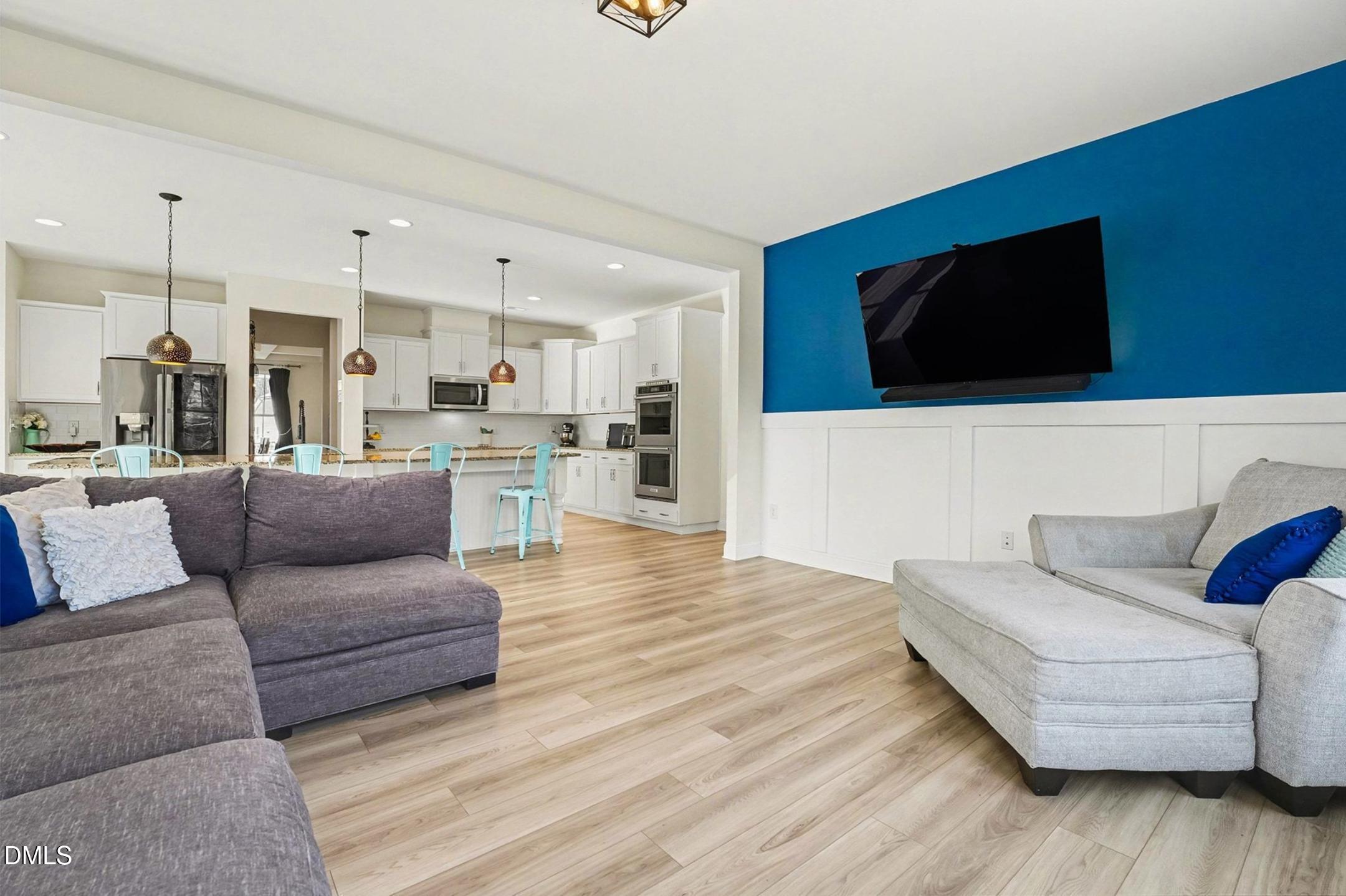 185 Twilight Trail Willow Spring, NC 27592 - Photo 7 of 42 a living room with furniture and a flat screen tv