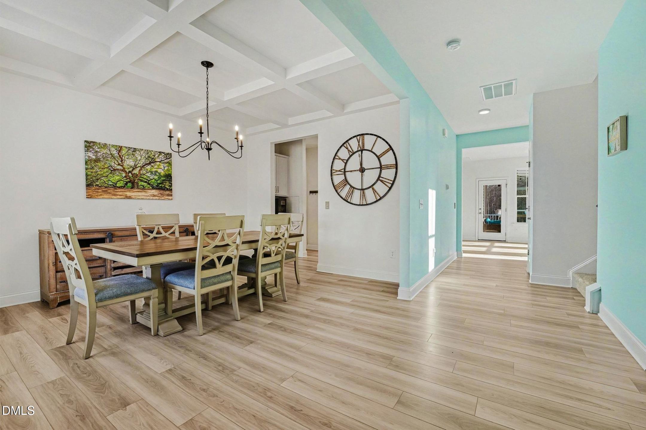 185 Twilight Trail Willow Spring, NC 27592 - Photo 8 of 42 a view of a dining room with furniture wooden floor and a clock