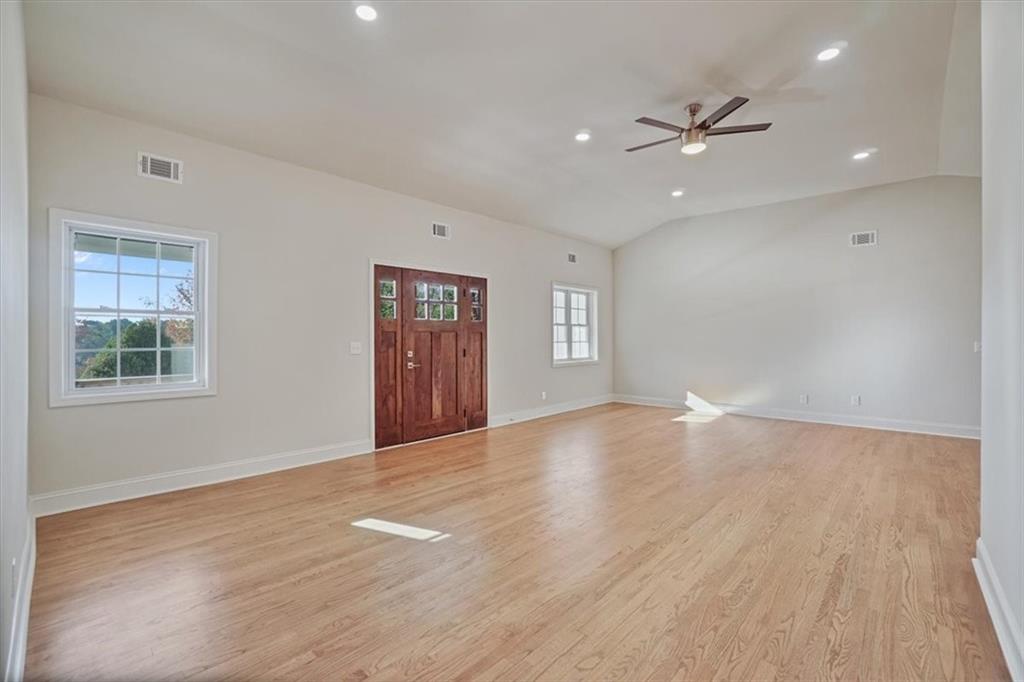 3062 Katherine Valley Road Decatur, GA 30032 - Photo 11 of 61 a view of an empty room with a window and wooden floor