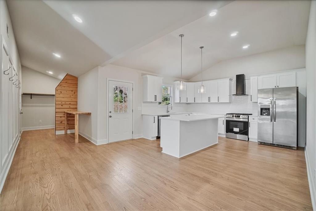 3062 Katherine Valley Road Decatur, GA 30032 - Photo 15 of 61 a large kitchen with stainless steel appliances kitchen island a large counter top and stainless steel appliances