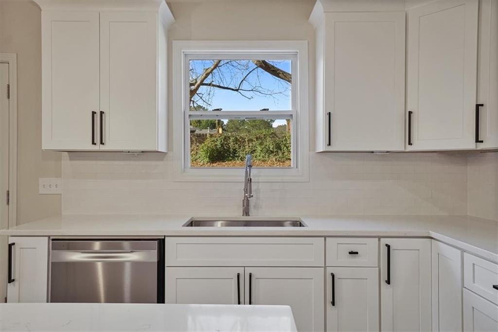 3062 Katherine Valley Road Decatur, GA 30032 - Photo 20 of 61 a kitchen with a sink and cabinets