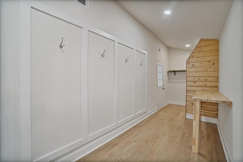 3062 Katherine Valley Road Decatur, GA 30032 - Photo 21 of 61 a view of an empty room with wooden floor and entryway
