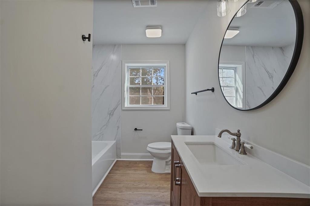 3062 Katherine Valley Road Decatur, GA 30032 - Photo 28 of 61 a bathroom with a sink and a mirror
