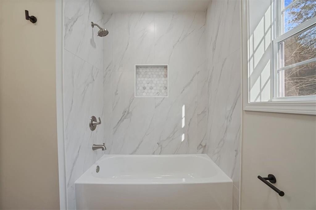 3062 Katherine Valley Road Decatur, GA 30032 - Photo 29 of 61 a bathroom with a bathtub