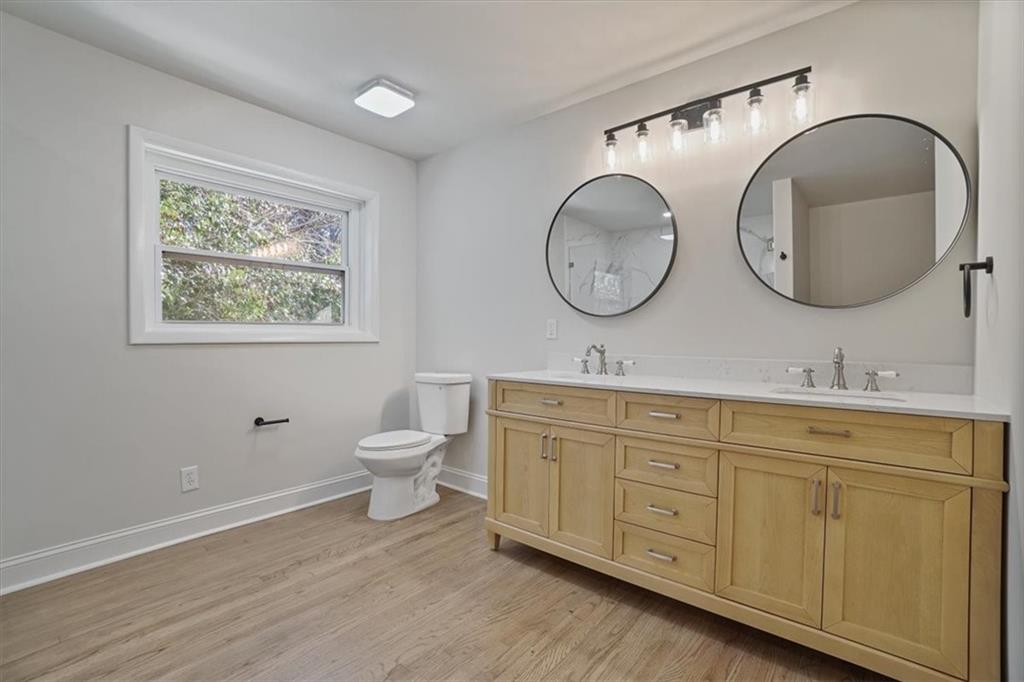 3062 Katherine Valley Road Decatur, GA 30032 - Photo 40 of 61 a bathroom with 2 toilet sink and a mirror