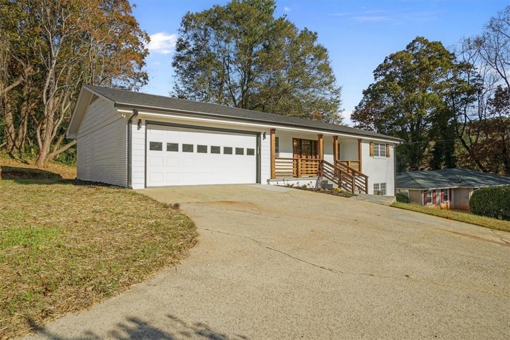 3062 Katherine Valley Road Decatur, GA 30032 - Photo 4 of 61 a front view of house with garage and yard