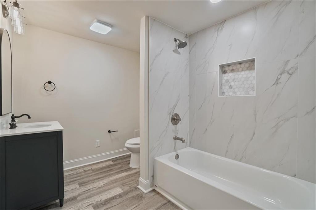 3062 Katherine Valley Road Decatur, GA 30032 - Photo 50 of 61 a bathroom with a toilet a sink and bathtub