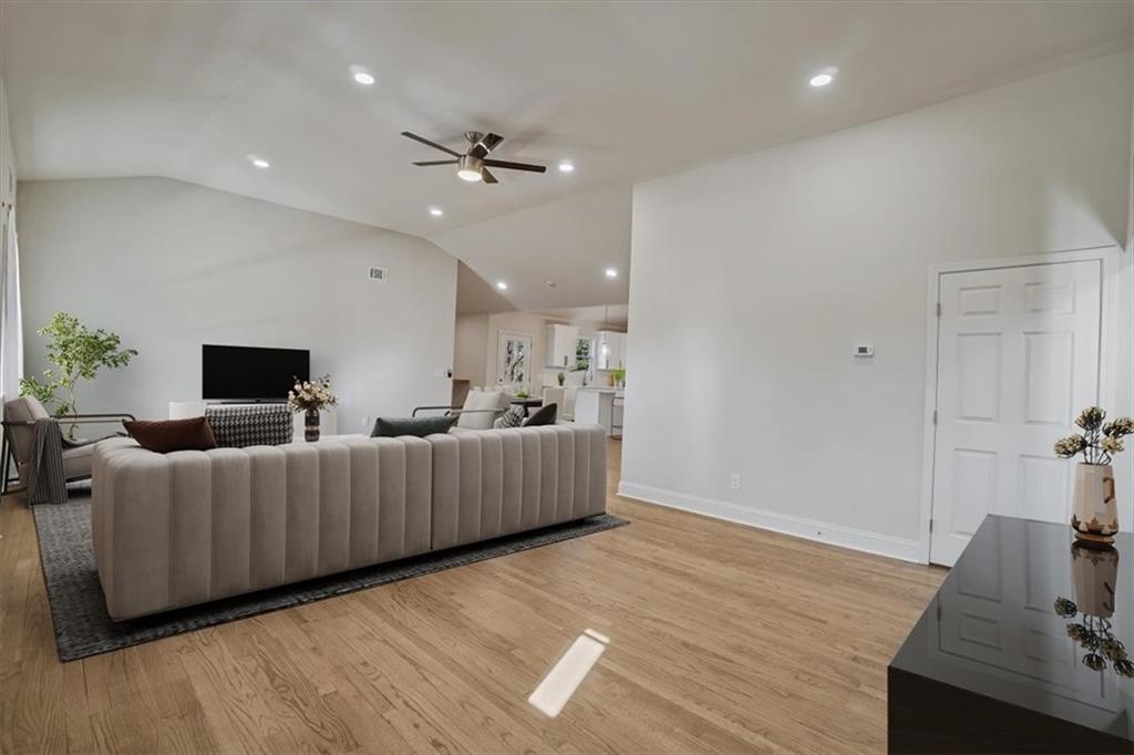3062 Katherine Valley Road Decatur, GA 30032 - Photo 10 of 61 a living room with furniture and a wooden floor