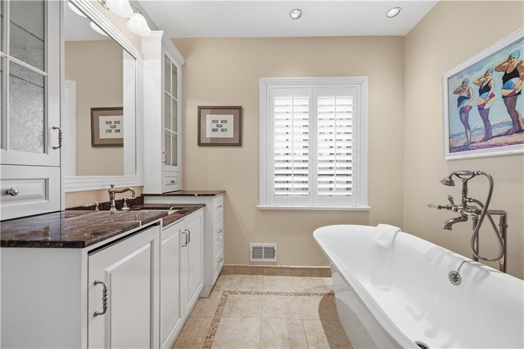 600 Backbone Road Sewickley, PA 15143 - Photo 40 of 50 A freestanding soaking tub creates a lovely focal point in the primary bath. Paired with classic finishes and natural light, the room feels calm, elegant, and spa-like.