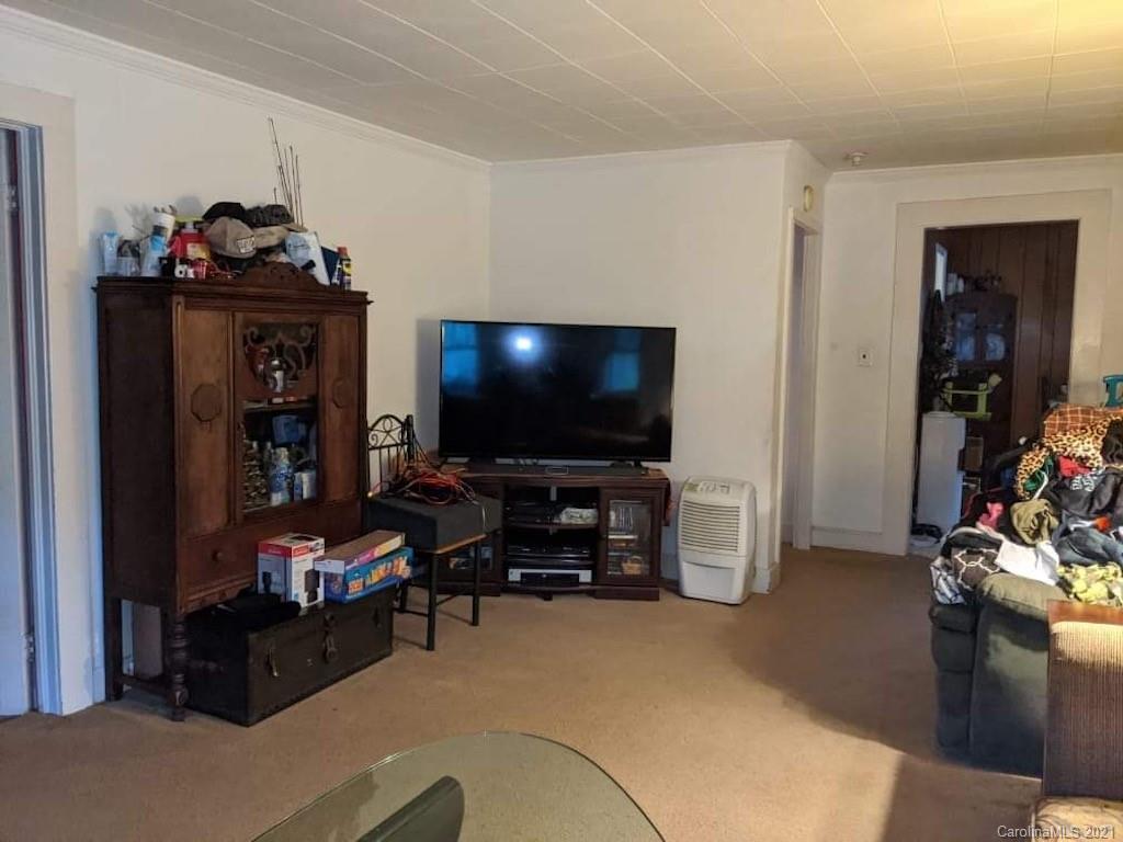 104 Old Fort Road Fairview, NC 28730 - Photo 7 of 10 a living room with furniture and a flat screen tv