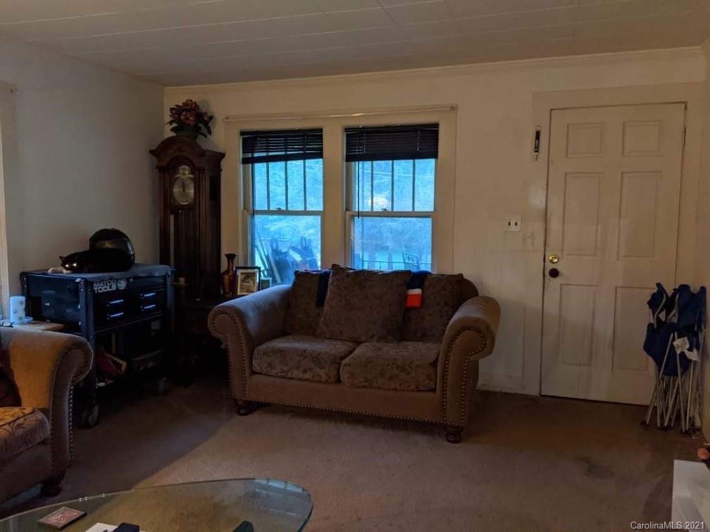 104 Old Fort Road Fairview, NC 28730 - Photo 8 of 10 a living room with furniture and a window