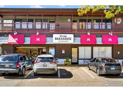 an aerial view of houses with a yard