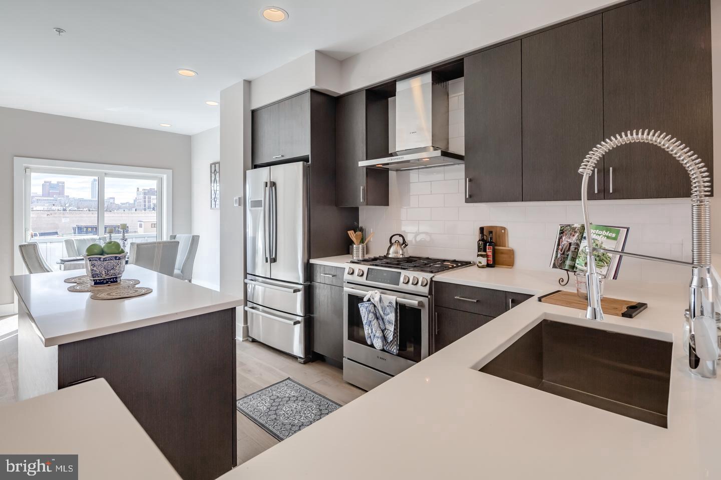 520 Fairmount Avenue Philadelphia, PA 19123 - Photo 2 of 24 a kitchen with a sink a stove and refrigerator