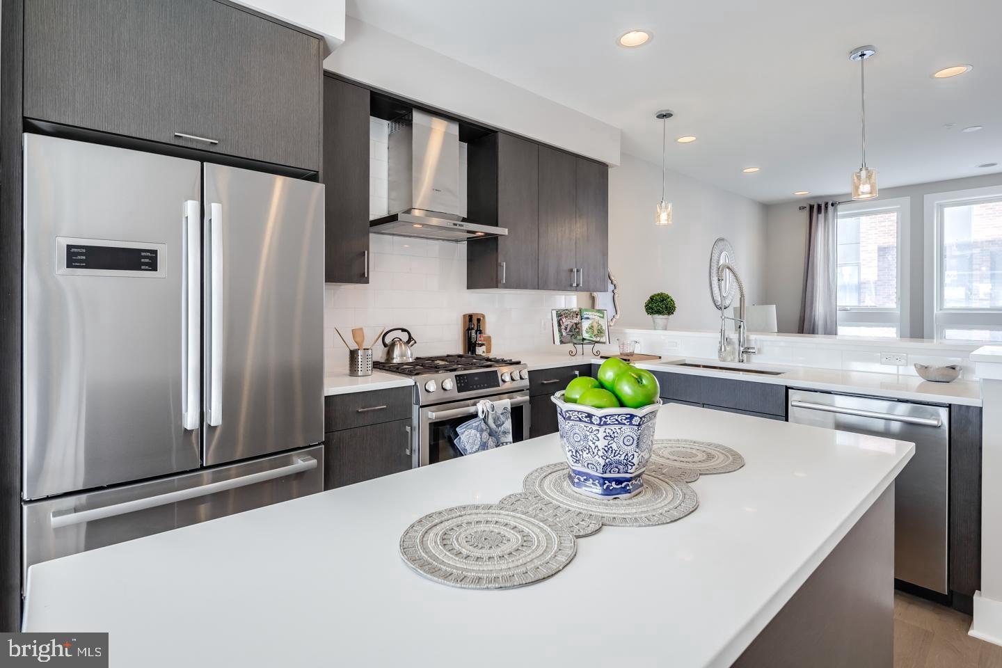 520 Fairmount Avenue Philadelphia, PA 19123 - Photo 3 of 24 a kitchen with a refrigerator and a stove top oven