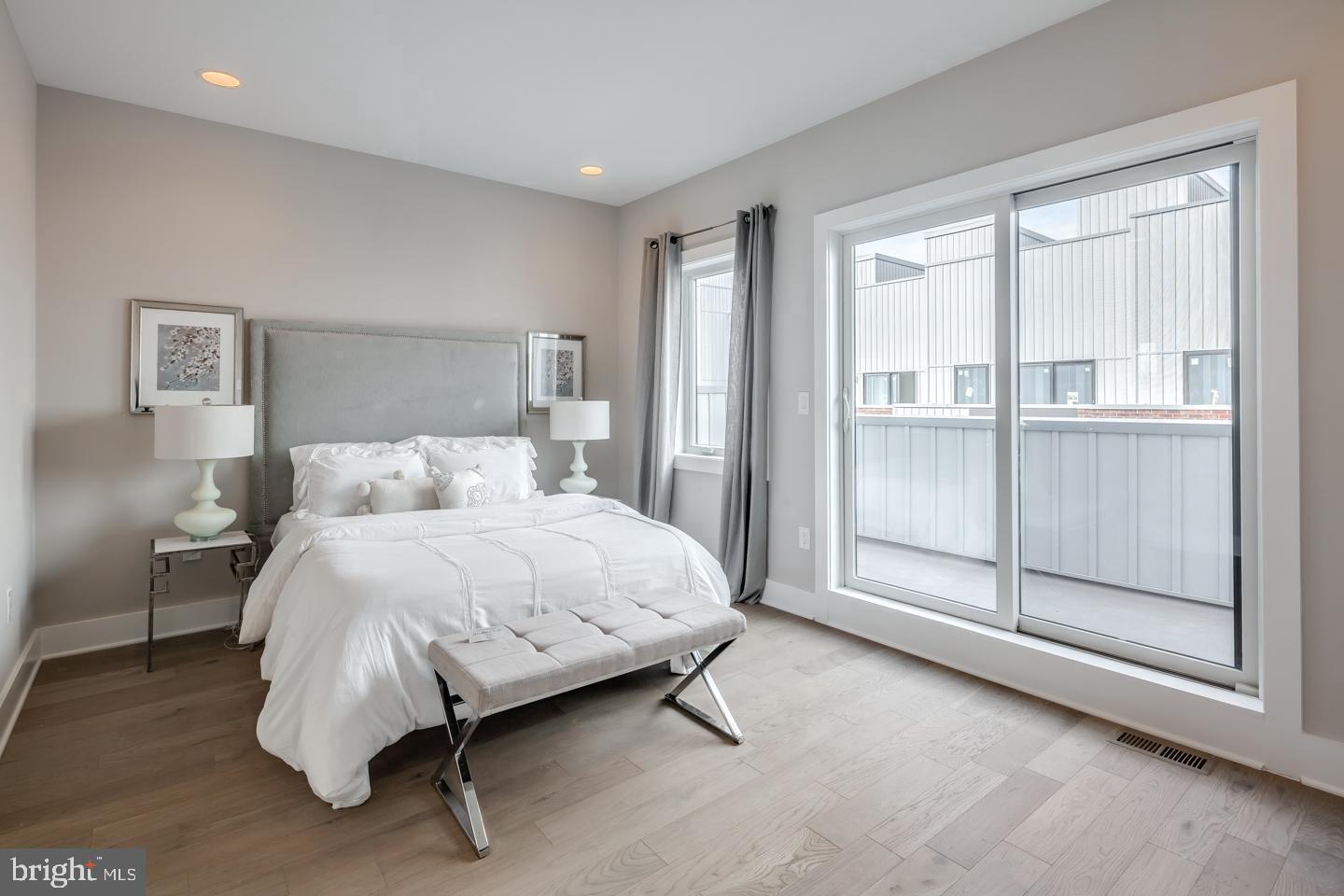 520 Fairmount Avenue Philadelphia, PA 19123 - Photo 10 of 24 a bedroom with a bed and with glass door