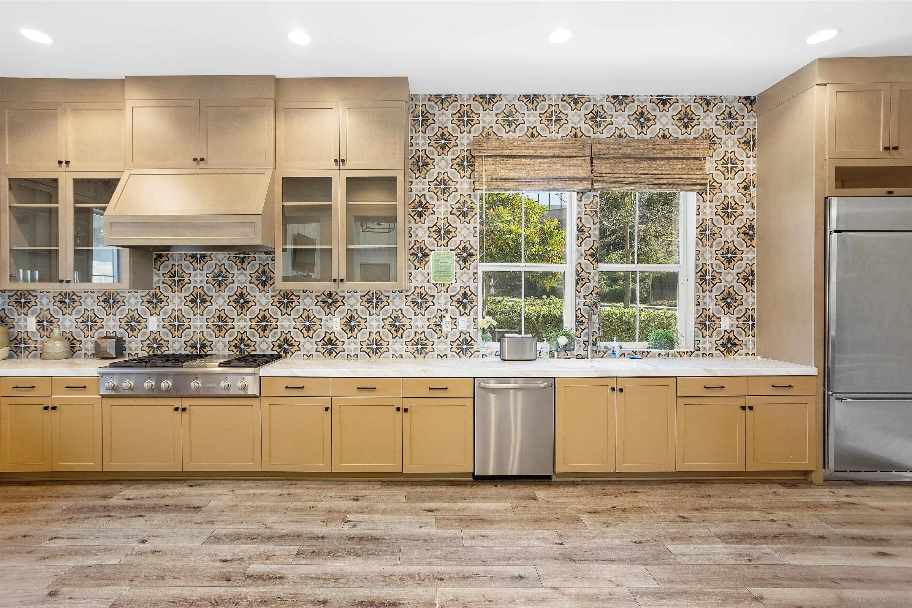 35835 Bay Sable Lane Fallbrook, CA 92028 - Photo 39 of 43 a kitchen with a stove a sink and a refrigerator