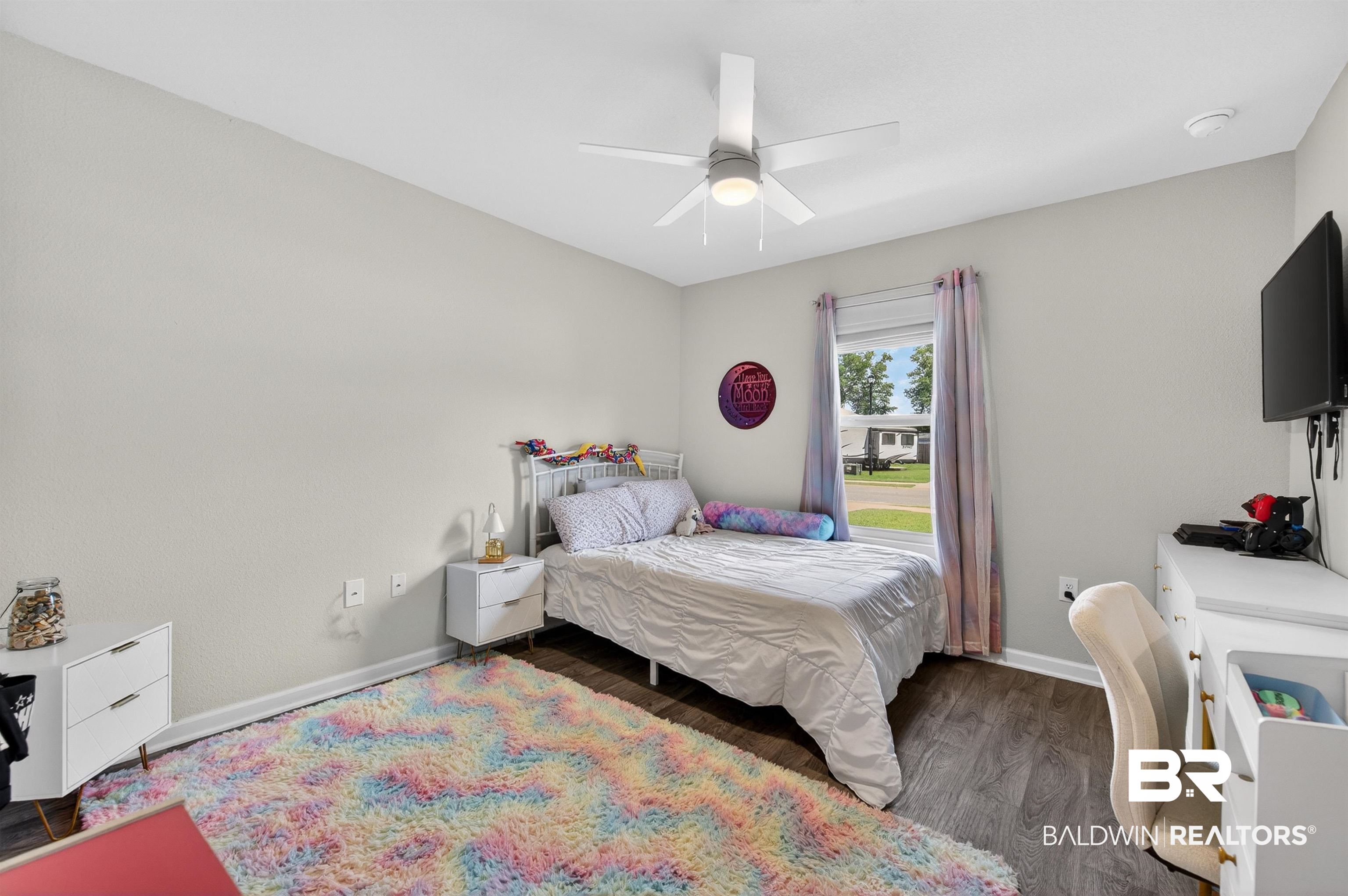 3213 Camino Real Loop Lillian, AL 36549 - Photo 54 of 61 Bedroom featuring wood-finish flooring, a ceiling fan with integrated lighting, and a window with a white blind