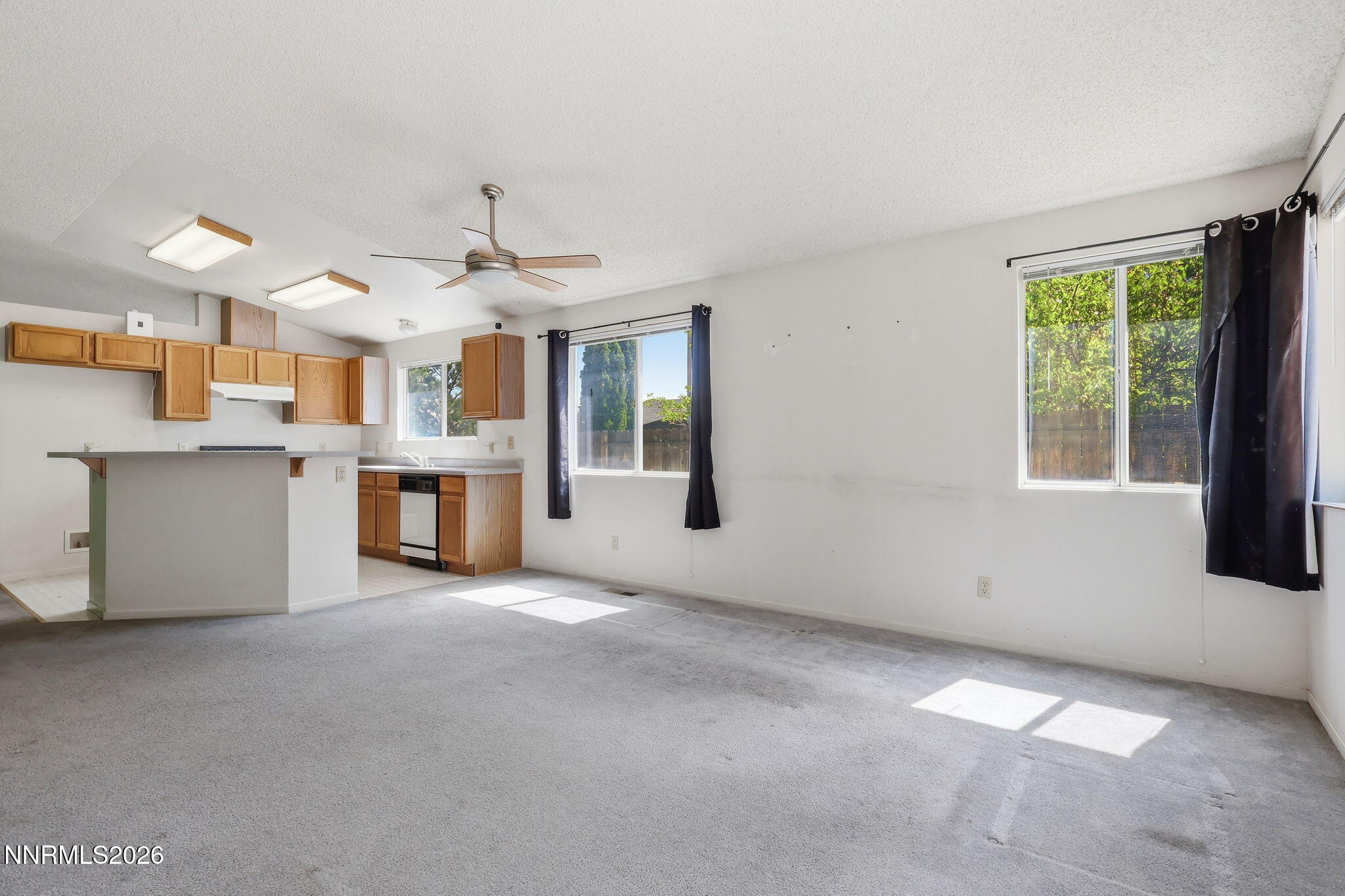 6840 Viscaya Court Reno, NV 89523 - Photo 17 of 25 a view of a kitchen with an empty shelves and a fireplace