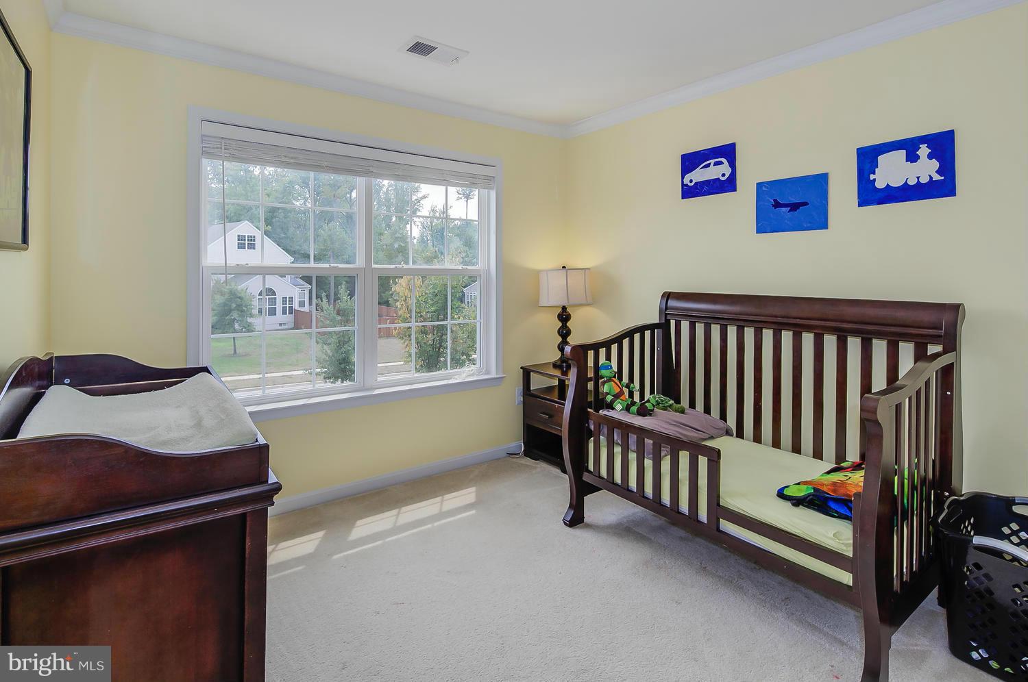 16613 Mannington Road Accokeek, MD 20607 - Photo 22 of 30 a bedroom with furniture and a window