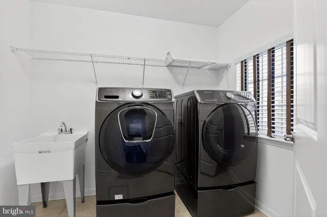 a utility room with dryer and washer